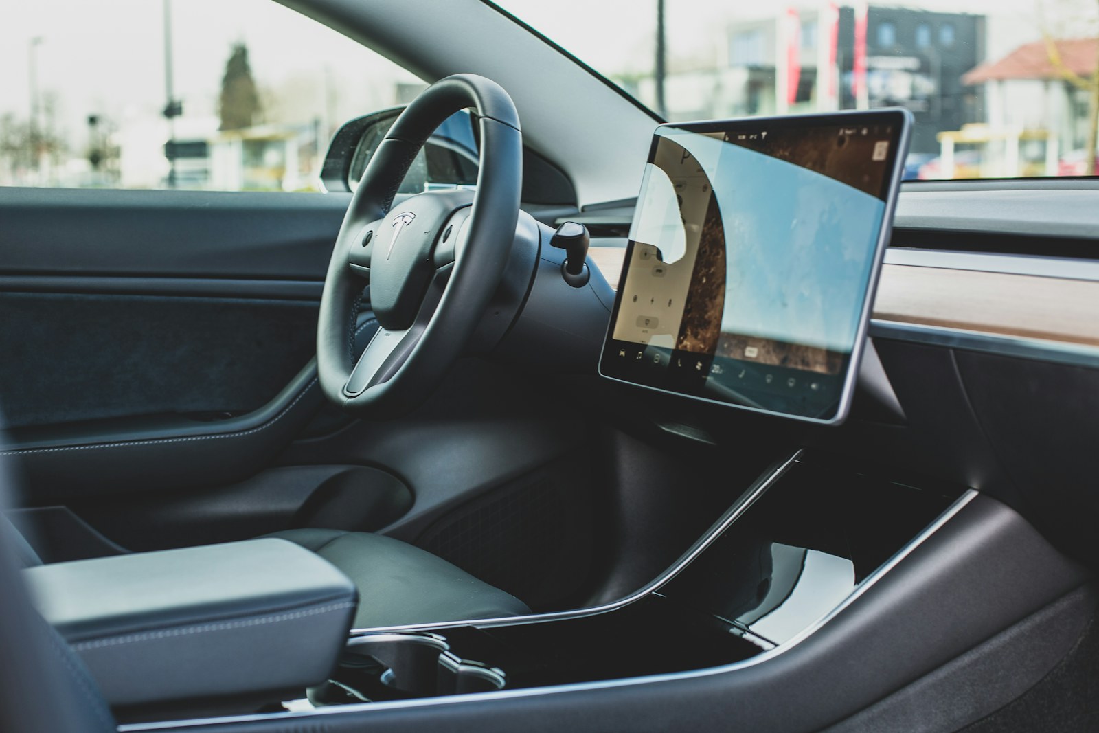 Tesla touchscreen and interior view for used Tesla FSD buying advice