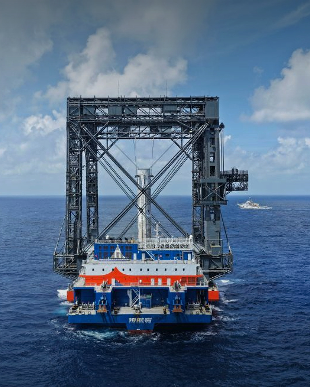 Long March 10B first-stage booster standing inside the sea-based net-capture system after recovery