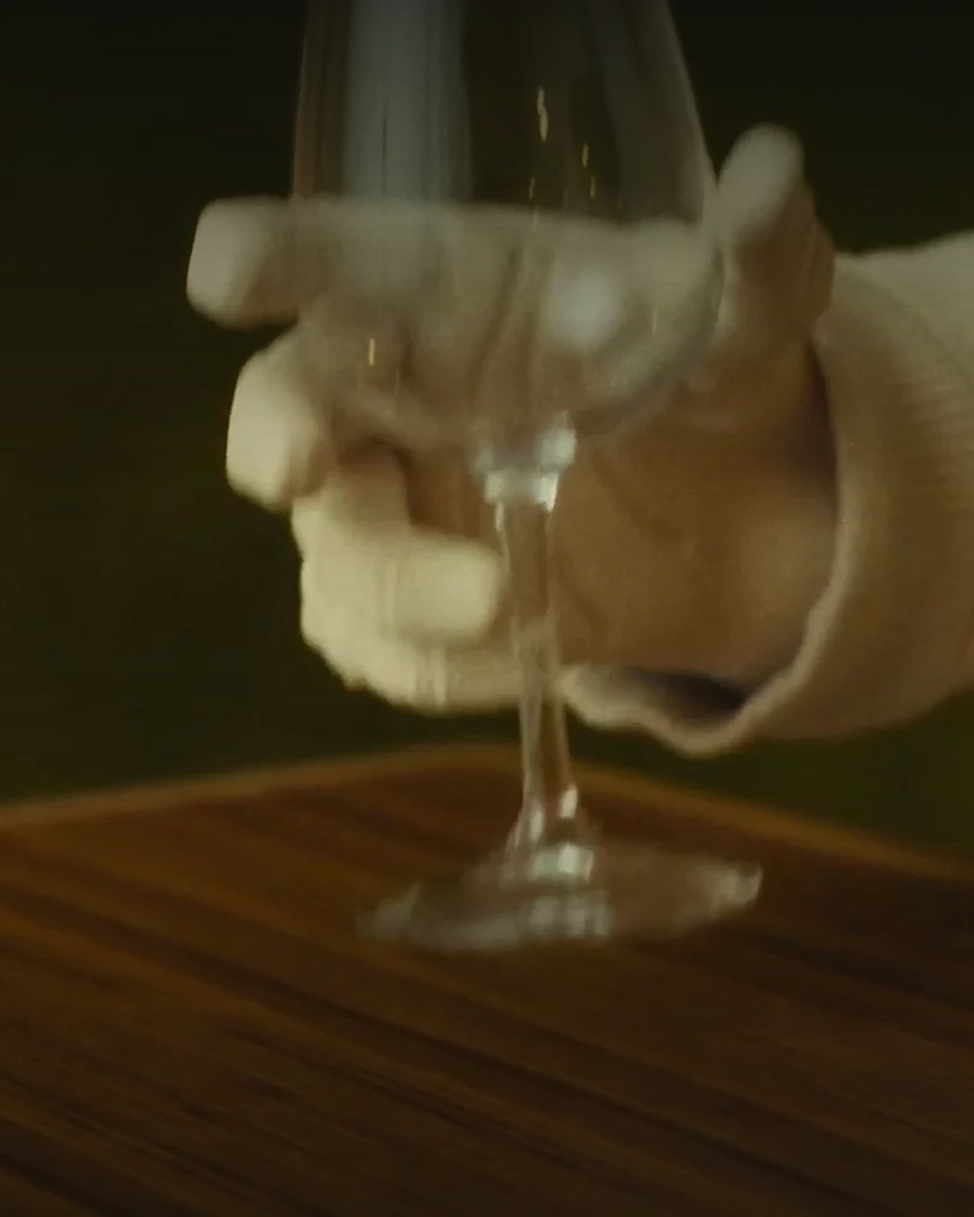 1X NEO robot hand holding a glass during the official hand demonstration