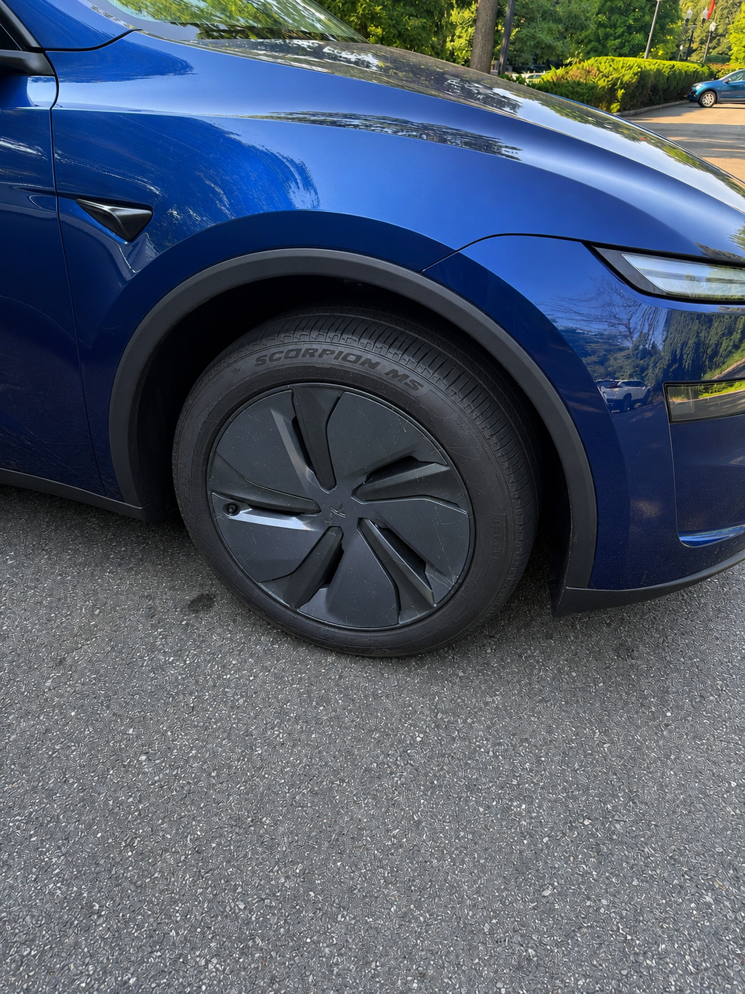 Front wheel and Pirelli Scorpion MS tire on our blue 2026 Tesla Model Y Juniper